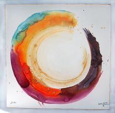 a painting with different colors on it in the shape of a circle and an oval