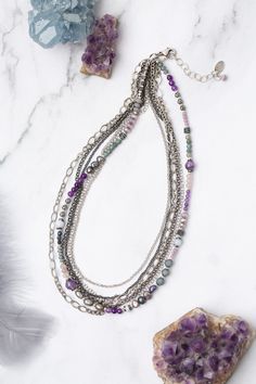 Experience the beauty and versatility of the Reflections Collection. Each piece is thoughtfully handcrafted using carefully chosen materials. This multistrand necklace measures 17.5-19.5" and is completed an antique silver plated brass extender chain and lobster claw clasp. Elevate your style with Reflections. Antique Silver Plated Brass (lead and nickel free) Amethyst, Czech Glass, Pearl 17.5-19.5", adjustable with antique silver plated brass lobster claw clasp We hand select our natural materi Silver Bohemian Beaded Necklaces For Layering, Silver Necklaces With Natural Stones For Layering, Silver Multi-strand Beaded Necklaces With Natural Stones, Silver Multi-strand Necklace With Natural Stones, Bohemian Multi-strand Silver Crystal Necklaces, Bohemian Silver Multi-strand Crystal Necklaces, Bohemian Silver Amethyst Beaded Necklace, Bohemian Multi-strand Silver Crystal Necklace, Handmade Silver Multi-strand Crystal Necklaces