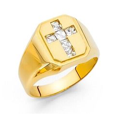 a gold ring with a cross on the front and two diamonds in the middle, set against a white background