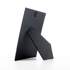 a pair of black ties sitting on top of each other