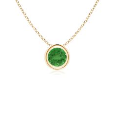 The round tsavorite appears to be floating on the chain. It is secured in a 14k yellow gold bezel setting and charms with its bright green hue. This solitaire pendant is simple and alluring. Classic Yellow Gold May Birthstone Necklace, Classic Green Emerald Necklace With Bezel Setting, Green Necklace With Bezel Setting For May Birthstone, Classic Green Birthstone Necklace, Elegant Green Birthstone Necklace With Bezel Setting, Green Birthstone Necklaces, Green Round Pendant Birthstone Necklace, Green Round Pendant Birthstone Necklace Fine Jewelry, Classic Green Jewelry With Smooth Bezel