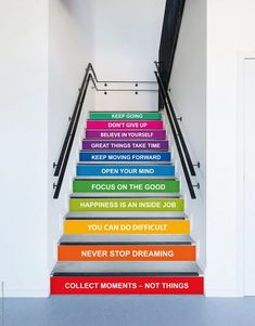 colorful stairs leading up to an open door with the words do not give up on them