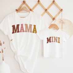 Mama mini shirt, retro mama tshirt, matching mommy and me shirt, custom mommy and me outfits, boho mom and daughter shirts baby tee SHIRT DETAILS We use Bella + Canvas t-shirts. UNISEX sizing - they are meant to have a loose fit. Please refer to our sizing chart in the photos for measurements along with tips on the fit for both ladies and guys. BABY & KIDS SHIRTS & BODYSUITS Depending on availability we alternate between the brands Bella + Canvas and Rabbit Skins bodysuits/tees, both have the sa Mama Mini Shirt, Boss Babe Shirt, Mom And Me Shirts, Boho Mom, Daughter Shirts, Mommy Daughter Outfits, Baby Tee Shirts, Babe Shirt, Mama Tshirts