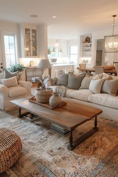 a living room filled with lots of furniture and decor on top of a wooden table