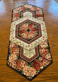 a large rug with flowers on it sitting on the floor