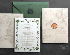 the wedding stationery is laid out on top of each other