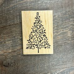 a wooden stamp with a christmas tree on it