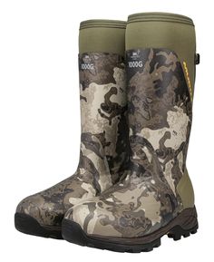 a pair of muddy boots with camo print on the side and black soles