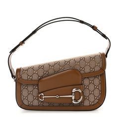 This is an authentic GUCCI Monogram Small Horsebit 1955 Asymmetric Shoulder Bag in Beige Brown Sugar. This stylish shoulder bag is crafted of Gucci GG monogram fabric. The bag features a front flap with a silver horse-bit detail, and adjustable leather handle. The bag opens to a beige fabric interior with a zipper pocket. Gucci Horsebit, Gg Monogram, Silver Horse, Gucci Monogram, Horse Bits, Stylish Shoulder Bag, Beige Fabric, Beige Brown, Leather Handle