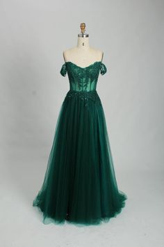 Introducing the Green BLAIR Off-shoulders Corset Tulle Ballgown Prom Dress by Jessica Stuart. This stunning dress is perfect for proms, weddings, or any fancy occasion. With an off-shoulder corset top adorned with delicate lace appliques and a full tulle skirt, you'll be sure to turn heads. The convenient zip-up back ensures a secure and comfortable fit. Choose from a range of glamorous colors, including pink, black, red, emerald green, royal blue, and white. Elevate your style with this elegant Ballgown Prom Dress, Red Beaded Dress, Tulle Ballgown, Fitted Prom Dresses, Green Corset, Full Tulle Skirt, Prom 2024, Stunning Wedding Dresses, London Dresses