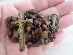 Religious catholic rosary with brown wooden beads and center with Holy Water Holy Mary of Lourdes and silvered cross crucifix. This is a nice rosary with 53  'Hail Mary' beads and 6 beads for 'Our Father' . The length of the circle of rosary is  31,2     inches    (    78    cm). The length of the rosary center with the cross is     8,6    inches     ( 21,5  cm ) I bought the rosary on a brocante ( fleamarket ) in  France. I still have a lot other  rosaries. If you don't have paypal, you can pay Brown Cross-shaped Rosary With Wooden Beads, Brown Wooden Beaded Cross Rosary, Brown Cross Rosary In Spiritual Style, Brown Cross-shaped Spiritual Rosary, Brown Spiritual Rosary With Cross, Brown Cross Shaped Spiritual Rosary, Holy Holy, Catholic Rosary, Sainte Marie