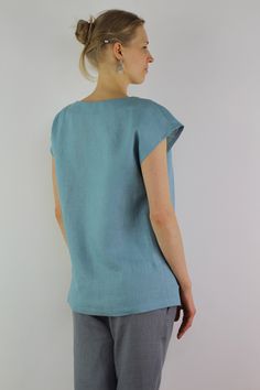 "Handmade turquoise linen blouse with short sleeves, perfect for casual wear and suitable for any occasion in any season Details: - 100% natural linen produced in Europe ; - medium weight (180 gram per square meter); - color: turquoise, can be any from our colors catalog (color samples at the photo); Made to order, approximately a few days, If you have any questions please message me and I will be glad to answer. Size guide : Size XS Bust: fits bust around 33\"-34\"/ 84-88 cm Waist: fits waist a Light Blue Relaxed Fit Linen Tops, Relaxed Fit Light Blue Linen Tops, Casual Turquoise Short Sleeve Blouse, Light Blue Linen Short Sleeve Top, Turquoise Short Sleeve Top For Summer, Turquoise Relaxed Fit Short Sleeve Top, Turquoise Short Sleeve Top With Relaxed Fit, Turquoise Short Sleeve Top Relaxed Fit, Blue Linen Short Sleeve Top