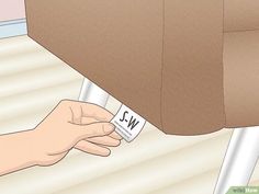 a hand is holding a name tag that says wj on it and the word wj below it