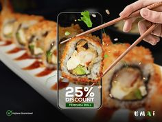 a person is holding chopsticks over some sushi