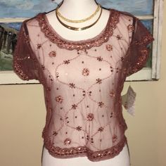 New Sale Price Marked Down Thus Week New Sequin Blouse Mesh Top. New. Copper And Pink Rosey Color. Bought It Cause So Cute But Was To Small For Me. About 18 Shoulder To Shoulder, 17.5 Long And 37 In Bust. No Trades. Sheer Short Sleeve Tops For Evening, Short Sleeve Lace Top For Party, Pink Short Sleeve Top For Evening, Feminine Sheer Top For Night Out, Summer Evening Short Sleeve Lace Top, Fitted Sheer Lace Top With Short Sleeves, Short Sleeve Lace Top For Evening In Summer, Evening Lace Top With Short Sleeves For Summer, Vintage Pink Tops For Party