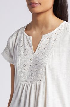 An airy openwork design tops this floaty top perfect for when the weather warms up. 24 1/2" length (size medium) Split neck Short sleeves 60% cotton, 40% modal with 100% cotton contrast Machine wash, tumble dry Imported Relaxed Fit V-neck Pointelle Knit Top, White Relaxed Fit Breezy Tops, Summer Pointelle Knit Tops For Daywear, White Cotton Pointelle Knit Tops, Breezy Relaxed Fit Cotton Tops, Relaxed Fit Breezy Cotton Top, Cotton Pointelle Knit Top With Relaxed Fit, Relaxed Fit Cotton Breezy Top, Casual Cotton Tops With Cutwork Hem