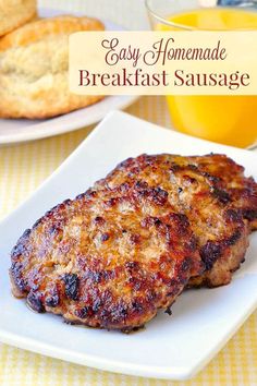 two meat patties on a white plate with orange juice and bread in the background