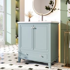 a bathroom vanity with a mirror above it and tiled flooring in front of it