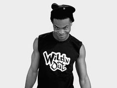 a man in a black tank top with the word wild out on it's chest