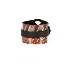 Snake Skin Cuff made of two layers of premium Italian leather. The Serpent Brown leather bracelet has a gold buckle closure. This unique artisanal handmade cuff is available in multiple leather textures and color combinations. It is a distinctive fashion statement to any wardrobe. This bracelet is a great gift for women. DETAILS 1.57" width 7.08" length Gold Closure Black and Walnut 100% genuine Italian Leather Handmade Made in USA Leather Bracelets With Wrist Strap As Fashion Accessory, Leather Double Band Bracelet With Leather Strap, Adjustable Leather Cuff Bracelet With Bracelet Strap, Brown Cuff Leather Bracelet, Brown Cuff Bracelets As Fashion Accessory, Brown Cuff Bracelet As Fashion Accessory, Adjustable Leather Wrap Bracelet Fashion Accessory, Adjustable Leather Wrap Bracelet As Fashion Accessory, Luxury Adjustable Leather Bracelet With Wrist Strap