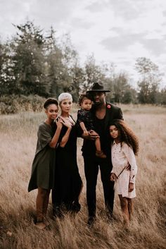 a family standing in the middle of a field