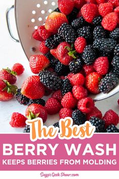 berries and raspberries in a colander with the words, the best berry wash keeps berries from molding