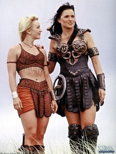 two women in costumes standing next to each other