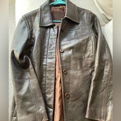 Buttery-Soft Leather Jacket That Has A Slightly Oversized Fit For A Relaxed Look. Dark Brown Exterior And Brown Lining On The Interior. Has One Pocket In The Left Interior Of The Jacket. Original Receipt Shown On The Last Picture. Has Light Wear And Tear. Coach Jackets, Coach Jacket, Leather Jackets Women, Leather Jackets, Soft Leather, Dark Brown, Jackets & Coats, Jackets For Women, Leather Jacket