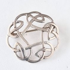 A small and simple vintage Celtic Knot brooch by Malcolm Gray in Orkney, marked to the reverse with "MG" in a circle and "925" to denote sterling silver, just an inch and light enough for some of the more delicate fabrics or as a lapel brooch. Silver Hallmarked Brooch, Silver Sterling Silver Brooches, Sterling Silver Round Brooches For Formal Occasions, Round Sterling Silver Brooches For Formal Occasions, Formal Round Sterling Silver Brooches, Sterling Silver Round Brooches For Anniversary, Simple Celtic Knot, Lapel Brooch, Recycled Metal