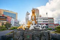 a fountain with cats and dogs on it