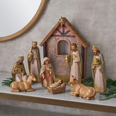 a nativity scene with figurines of the birth of jesus