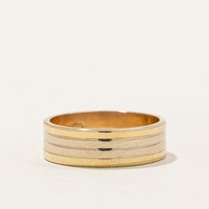 a gold and white striped ring on a white background