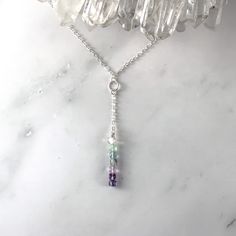 Your new Elegant Fluorite necklace would dress up even the dullest outfit, with it's gentle rainbow hues in greens, blues and purples, reminding us of the natural world. Wear this delicate Y Lariat design as a Protective crystal talisman which features Fluorite gemstone cube beads and Sterling Silver chain 💚 Fluorite is a must for empaths learning to hone and command their skills, and learning to protect themselves. 💙 Fluorite represents your inner knowing and a sense of peacefulness and conte Crystal Jewelry Design, Fluorite Jewelry, Inner Knowing, Fluorite Gemstone, Empath Protection, Fluorite Necklace, Raw Crystals, Cube Beads, Rainbow Fluorite