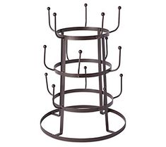 three tiered metal candle holder with four candles on each side and two circular holders in the middle