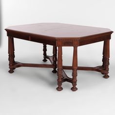 an old style wooden table with two legs and a square top, on a white background