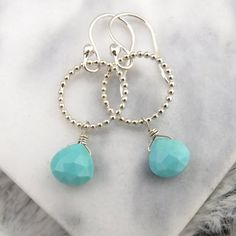 These Elegant Earrings Feature Large Silver Beaded Hoops On French Hook Ear Wires With Stunning Sleeping Beauty Turquoise Heart Briolettes. These Earrings Are A Perfect Sophisticated Everyday Earring To Make Any Look Polished And Finished. Earrings Measure 1.5 Inches From Top Of Ear Wire To The Bottom Of The Leaf. The Hoops Are 5/8 Of And Inch Across. All Metal Is .925 Nickel Free Sterling Silver. These Earrings Come In A Beautiful Black Box With Silver Bow Ready For Gift Giving. Tags: Light Blu Sterling Silver Teardrop Earrings With Silver Beads, Turquoise Sterling Silver Round Bead Jewelry, Turquoise Round Beads Sterling Silver Jewelry, Turquoise Sterling Silver Round Beaded Jewelry, Blue Teardrop Jewelry With Silver Beads, Turquoise Faceted Drop Earrings, Turquoise Teardrop Faceted Jewelry, Teardrop Silver Beads Jewelry As Gift, Teardrop Silver Beads Jewelry Gift