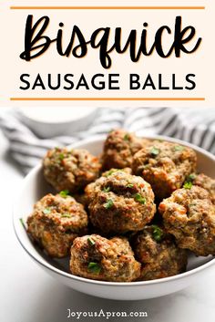 a white bowl filled with sausage balls on top of a table