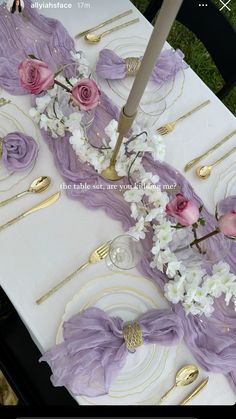 the table is decorated with purple and white flowers