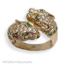 Medallion Trading Company   14K YELLOW GOLD  PANTHER RING WITH DIAMONDS & EMERALDS- SIZE 6.5   Condition: Excellent pre-owned condition. Professionally cleaned and polished Weight: 7.88 grams Size: 6.5 Measurements: The ring is approximately 16 mm (north to south)  Markings: 585 Diamonds: (66) natural round cut diamonds estimated at .01 carats each with a clarity of VS1 and color of G Gemstones: (14) natural round cut emeralds approximately .02-.03 carats each with good vivid color and excellent clarity     Q: What payments do you accept? A: We take Paypal, Visa, Mastercard, American Express and Discover.     Q: What countries do you ship to? A: We ship internationally, so please see the pull down box under the 'Shipping and Payments' tab at the top of this listing to find your country's s Panther Ring, Wrap Ring, Vivid Color, Trading Company, Wrap Rings, American Express, Visa Mastercard, Round Cut Diamond, Panther