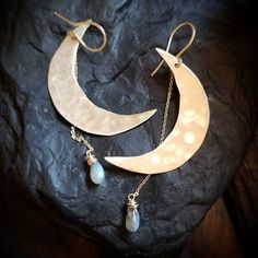 "These signature moondrop earrings feature an iridescent labradorite stone that suspends from a handcrafted, rough cut and hammered, golden brass or antique copper crescent moon. ~14k handcrafted gold fill French hooks & chain ~3\" drop length ~Wrapped in black gift box ~Handmade in Tennessee" Celestial Teardrop Pierced Jewelry, Moonstone Dangle Jewelry With Moon Charm, Hand Forged Labradorite Dangle Earrings, Moon Phase Drop Earrings For Jewelry Making, Nickel Free Crescent Moonstone Jewelry, Nickel-free Crescent Moonstone Jewelry, Crescent Moonstone Earrings With Moon Phase Detail, Crescent Moonstone Earrings With Moon Phase, Unique Moon Charm Drop Earrings