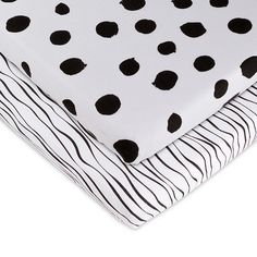 two pieces of black and white polka dot fabric