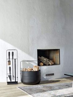 a living room filled with furniture and a fire place next to a wall mounted fireplace