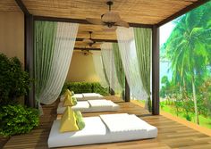 an outdoor covered patio with white pillows and green curtains on the ceiling, along with palm trees