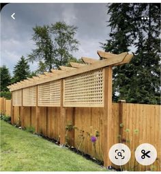 a wooden fence that has some plants growing on top of it and an arrow pointing to the right