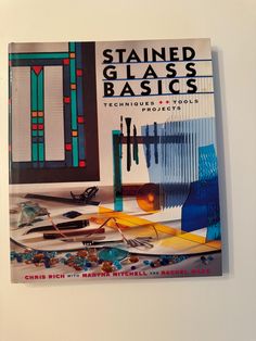 a book on stained glass basics is displayed