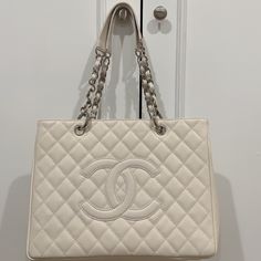 Ivory Chanel Classic Tote With Silver Chain. Brand New Condition. High-end White Rectangular Bag, High-end White Shoulder Bag, High-end White Double Handle Bag, High-end White Rectangular Shoulder Bag, High-end White Bag For Daily Use, High-end White Shoulder Bag For Shopping, Luxury Cream Rectangular Bag, Classic Cream Bag For Everyday Luxury, Luxury Cream Rectangular Shoulder Bag