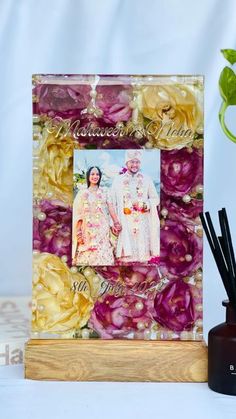 an artistic photo frame with flowers on it