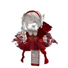 a red and white doll is dressed up