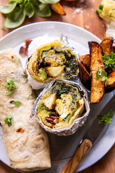 an assortment of food on a plate with some bread and other foods in the background