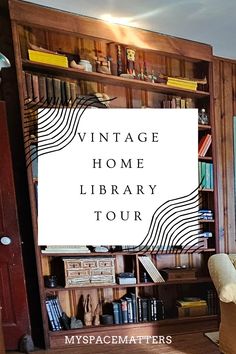 a room with a bookcase and chair in it that says vintage home library tour